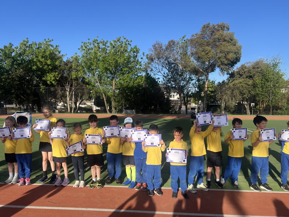 Pateka players holding their certificates at their school